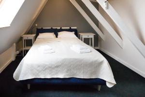 Postel nebo postele na pokoji v ubytování Apartamenty Vilda