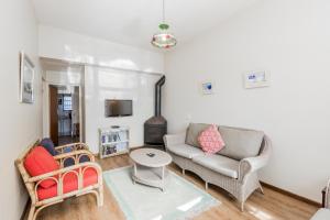 a living room with a couch and a table at Seas the Day in Arniston