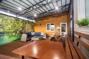 a screened in porch with a table and a couch at Mini-Hotel Ocean in Kyiv