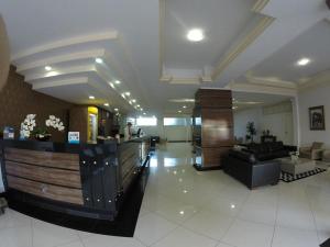 a lobby of a hotel with a reception desk at Havana Palace Hotel II in Uberaba