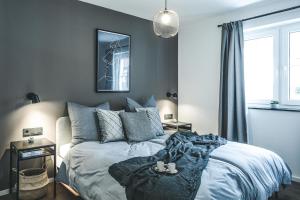 Säng eller sängar i ett rum på Oskar Apartments