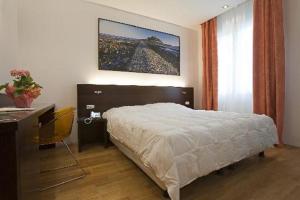 En eller flere senge i et værelse på Vesta Domus