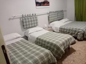Posteľ alebo postele v izbe v ubytovaní Olimpica Relais guest house