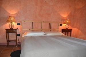 Postel nebo postele na pokoji v ubytování Agriturismo Cignanbianco + 37 fotografií