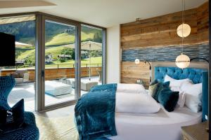 A bed or beds in a room at Chalet SALENA luxury lodge