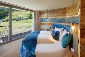 A bed or beds in a room at Chalet SALENA luxury lodge