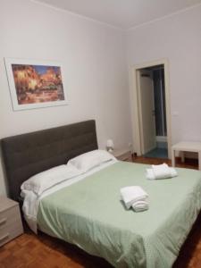 Posteľ alebo postele v izbe v ubytovaní Olimpica Relais guest house