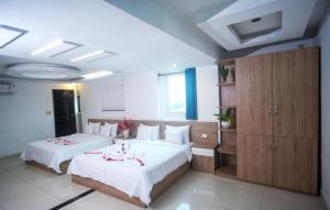 Postel nebo postele na pokoji v ubytování H79 HOTEL