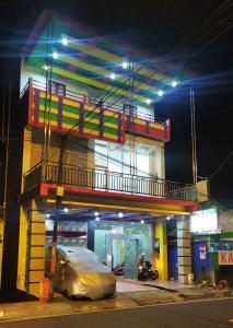 a car parked in front of a gas station at night at Wisma Aira in Ternate