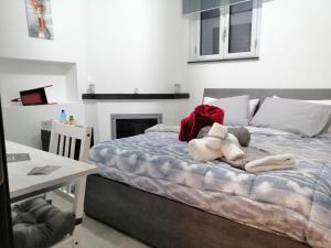 A bed or beds in a room at B&B I SIKULI