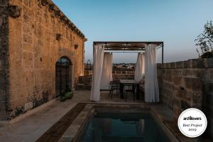The swimming pool at or close to Dimora Sighé, exclusive rural villa with hydromassage pool