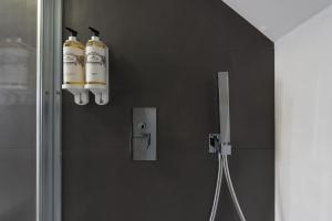 a bathroom with two fire hydrants hanging on a wall at Apartamentos do Prado In Douro in Vila Real