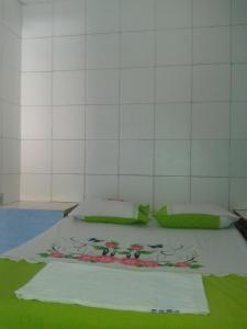 Säng eller sängar i ett rum på Pousada Odemir Ferreira