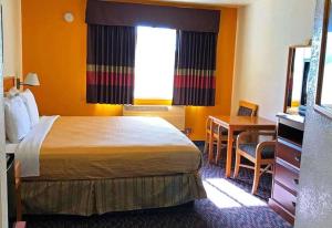 Ένα ή περισσότερα κρεβάτια σε δωμάτιο στο Americas Best Value Inn Dunnigan