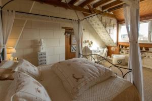 a bedroom with a bed with a canopy at Les charmes in Valençay