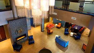 an overhead view of a lobby with couches and chairs at Holiday Inn & Suites Mississauga West - Meadowvale by IHG in Mississauga