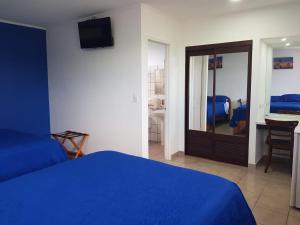 Postel nebo postele na pokoji v ubytování Hotel Grosseto Palma Real