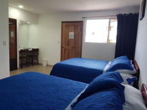 Postel nebo postele na pokoji v ubytování Hotel Grosseto Palma Real