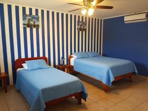 Postel nebo postele na pokoji v ubytování Hotel Grosseto Palma Real