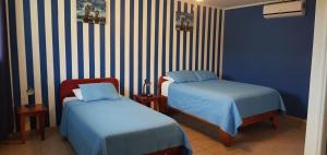 Postel nebo postele na pokoji v ubytování Hotel Grosseto Palma Real