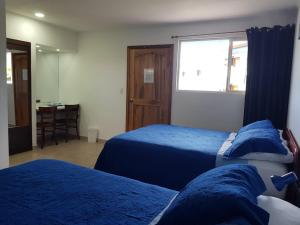 Postel nebo postele na pokoji v ubytování Hotel Grosseto Palma Real
