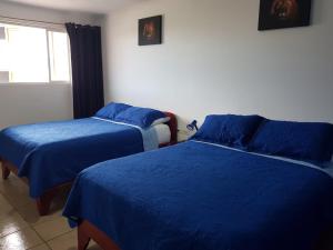 Postel nebo postele na pokoji v ubytování Hotel Grosseto Palma Real