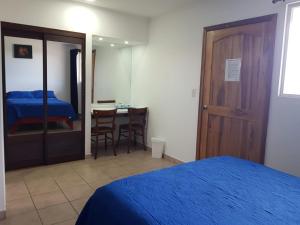 Postel nebo postele na pokoji v ubytování Hotel Grosseto Palma Real