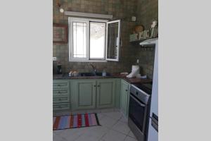 Kuchyň nebo kuchyňský kout v ubytování Eftychias residence