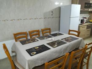 a kitchen with a table with a white table cloth at De la mare la munte in Vatra Dornei