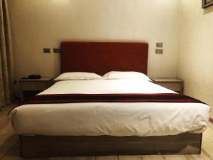 Postel nebo postele na pokoji v ubytování Igiban Hotel