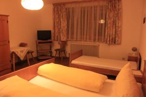 Postel nebo postele na pokoji v ubytování Pension & Restaurant TsingDao