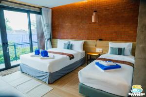 Ένα ή περισσότερα κρεβάτια σε δωμάτιο στο Sea Sand Sun Resort, Lanta Island