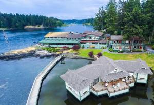 an aerial view of a large house on the water at April Point Resort in Quathiaski Cove