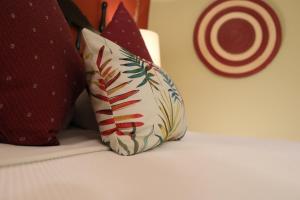 a pillow sitting on top of a bed at Hotel Montetaxco in Taxco de Alarcón