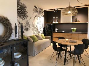 a living room with a table and a couch at Residence Relais Cà dell'Era in Tremosine Sul Garda