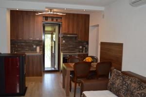 a kitchen and dining room with a table and chairs at Villa My Island in Bihać