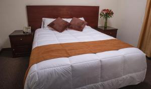Cama ou camas em um quarto em Hotel Ferrua