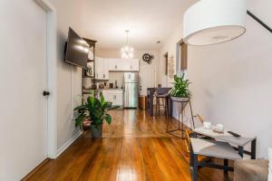 a kitchen and living room with a hard wood floor at ✪ Cozy 1 Bedroom close to Downtown Chicago ✪ in Chicago