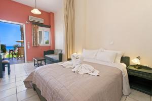 Ένα ή περισσότερα κρεβάτια σε δωμάτιο στο Aegealis Studios