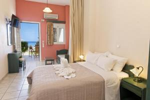 Ένα ή περισσότερα κρεβάτια σε δωμάτιο στο Aegealis Studios