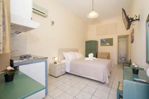 Ένα ή περισσότερα κρεβάτια σε δωμάτιο στο Aegealis Studios