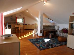 a living room with a couch and a fireplace at MANSARDA PARADISO GOLFO DI PORTOFINO in Sestri Levante