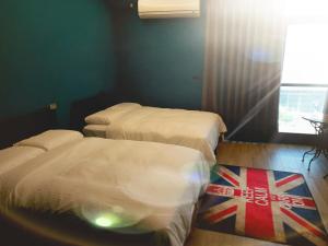 Voodi või voodid majutusasutuse Fangliao Chun Lai Homestay toas