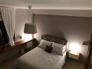 Posteľ alebo postele v izbe v ubytovaní B&B Capuam Vetere Accommodation
