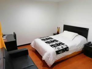 Ένα ή περισσότερα κρεβάτια σε δωμάτιο στο Hotel Palermo Suite