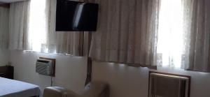 TV a/nebo společenská místnost v ubytování Hotel Verlaine adult only