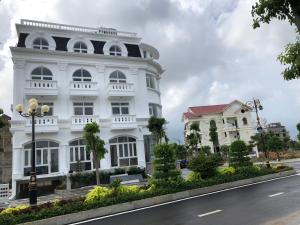 a white building on the side of a street at THE VILLA HIEU HY in Quy Nhon