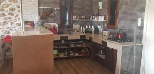 a kitchen with a sink and a counter top at Bird branch house in Boulaouane