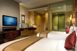 TV a/nebo společenská místnost v ubytování InterContinental Tangshan by IHG