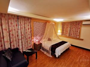 Postelja oz. postelje v sobi nastanitve Yilan Golf B&B